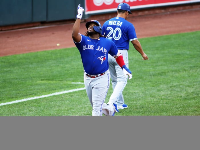 Sept. 11, 2021; Baltimore, Maryland, USA; Toronto Blue Jays designated hitter Vladimir Guerrero Jr. (27) hits a home run during the third inning against the Baltimore Orioles at Oriole Park at Camden Yards.